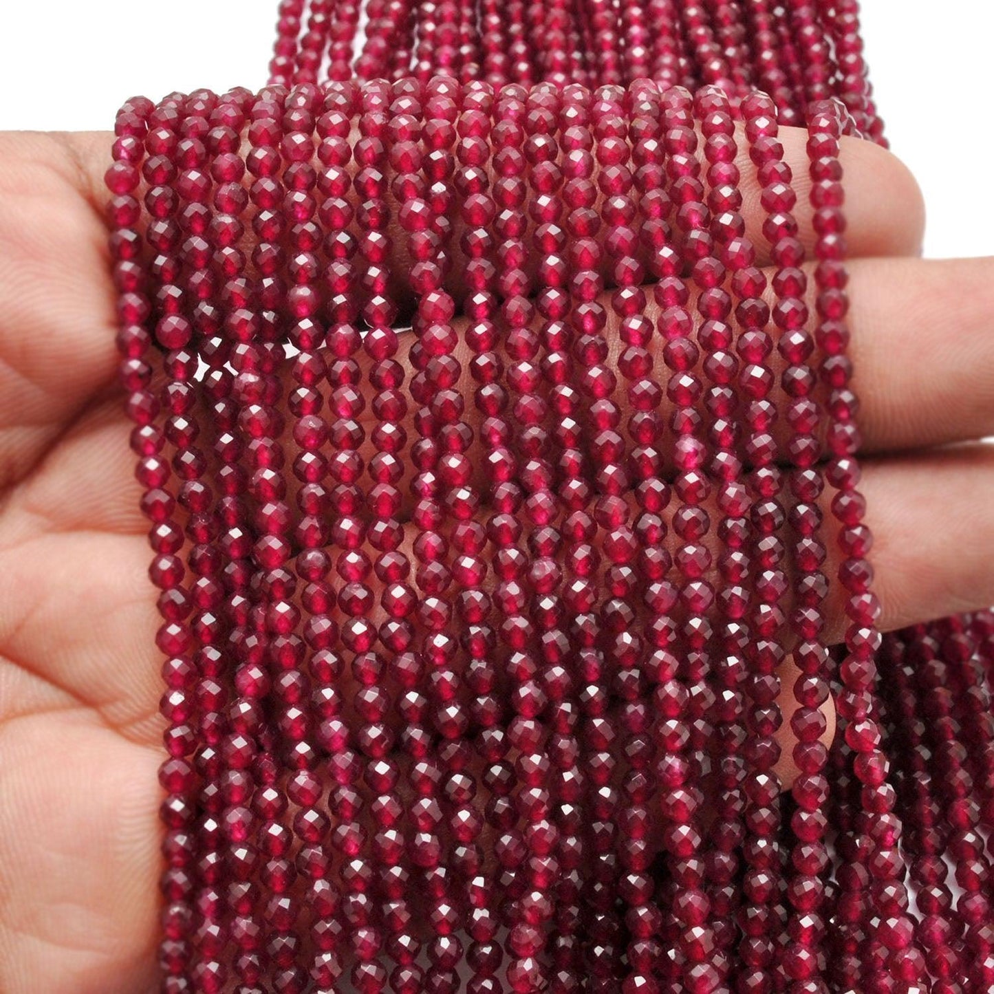 Ruby quartz round faceted beads knotted strand display