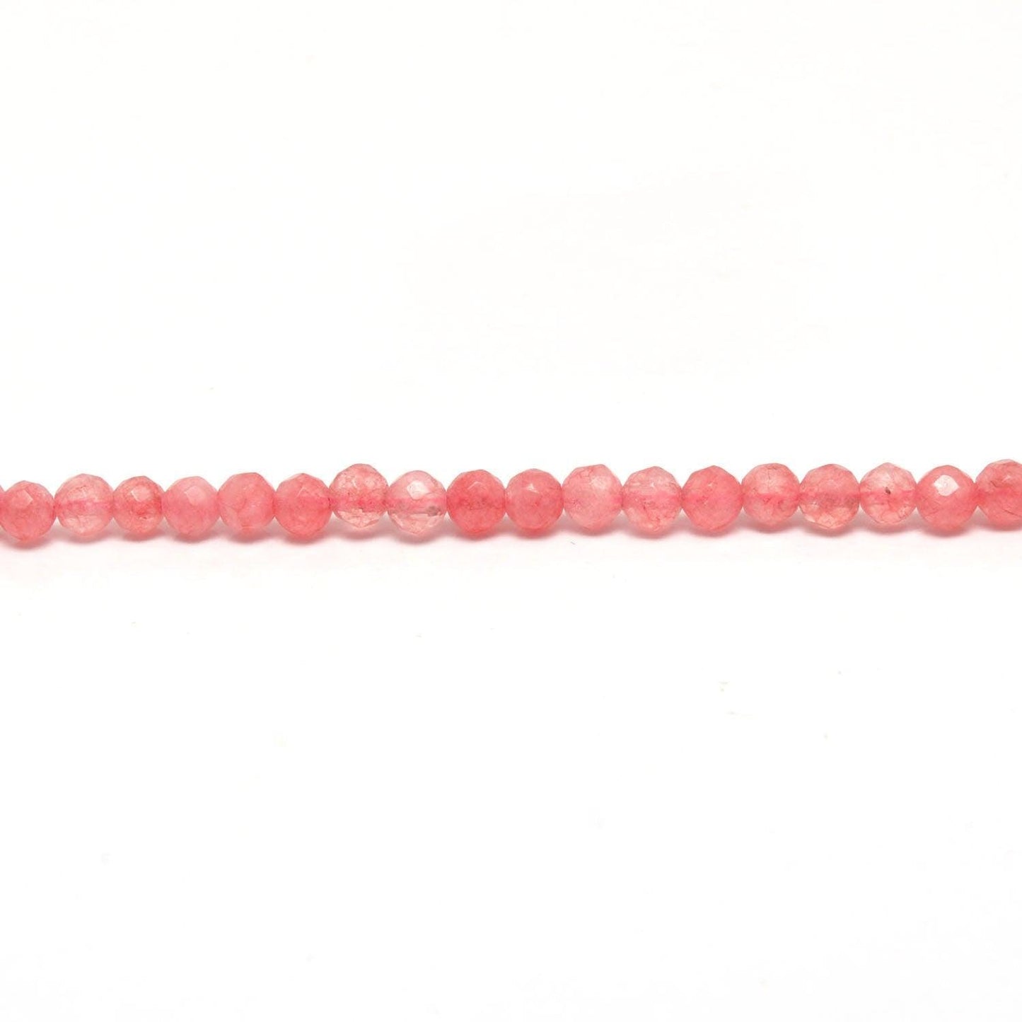 Pink quartz petite faceted round beads scattered loose view Jaipur