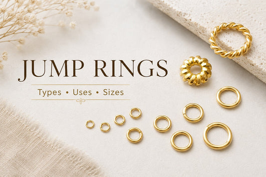 Gold jump rings in different sizes and shapes for jewelry making, including round and twisted designs.