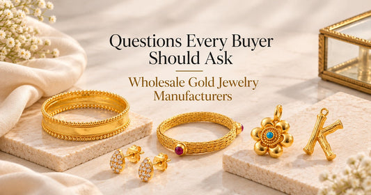 Gold jewelry pieces arranged for a guide on questions to ask wholesale gold jewelry manufacturers