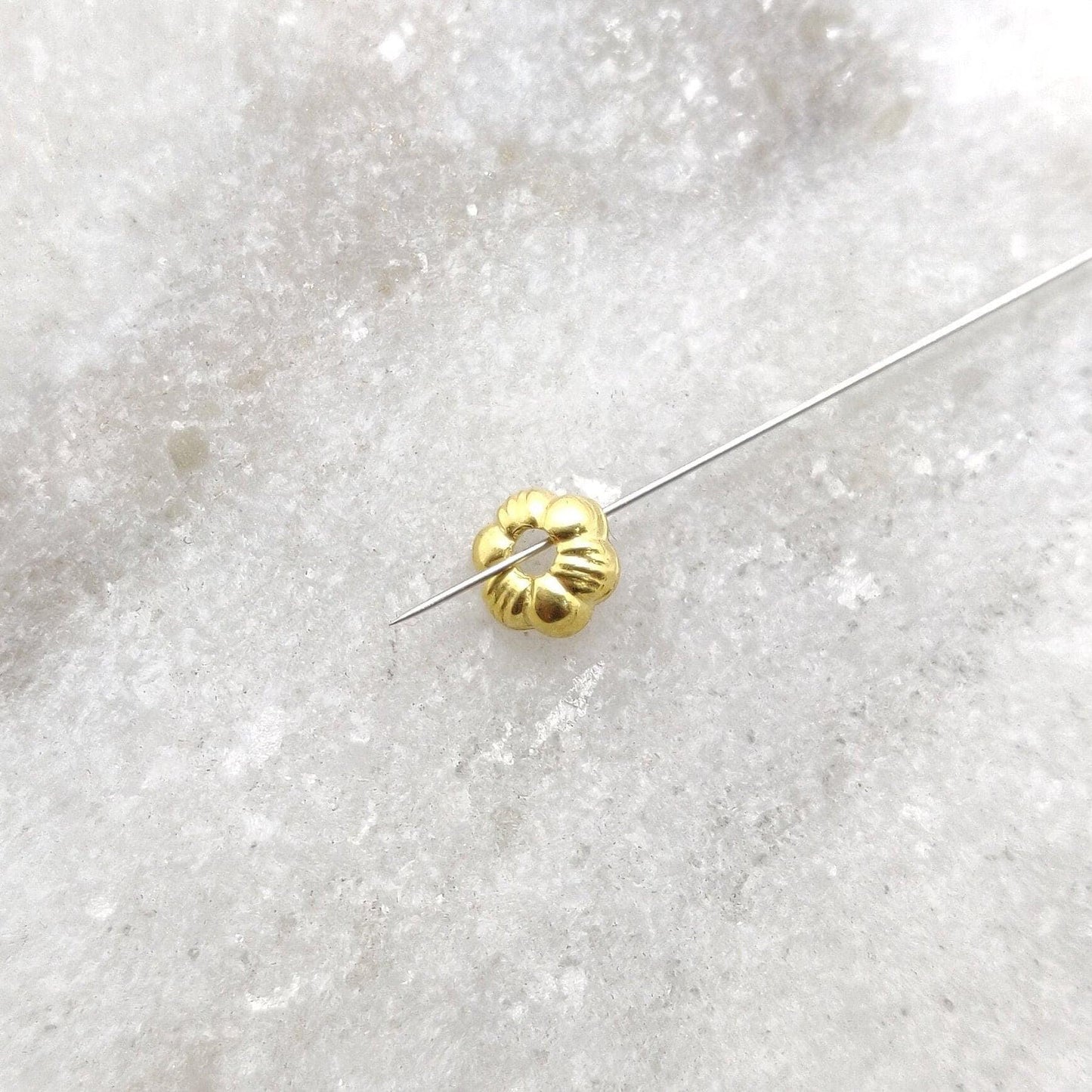 18K gold daisy flower cap - overhead view Jaipur