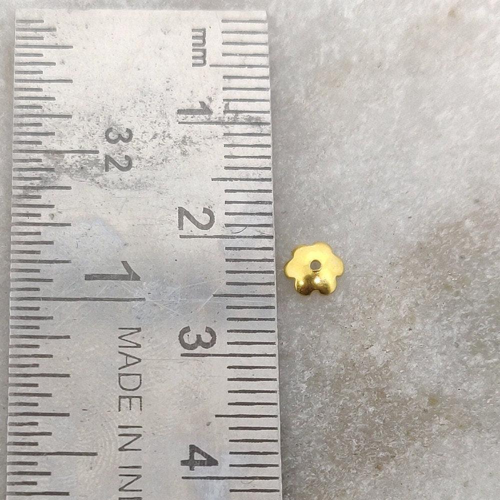 18K gold floral bead caps 1x5mm styled on seed pearl strand