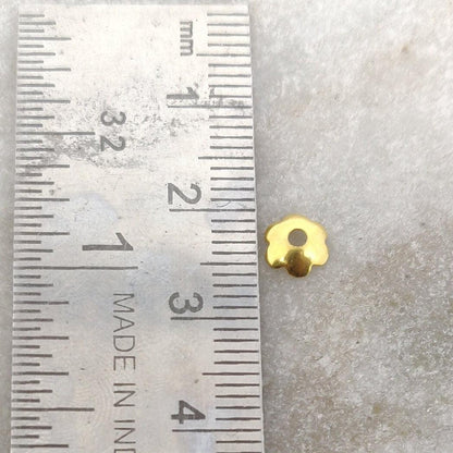 18K gold floral plain bead caps 2x6mm styled on delicate necklace