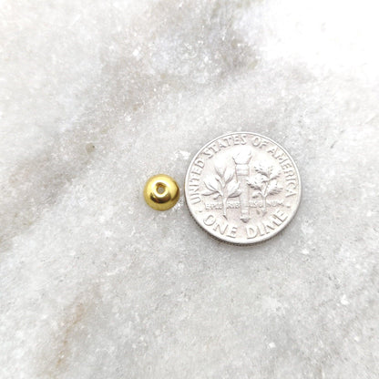 18K gold round plain cap 6mm - close-up minimalist detail