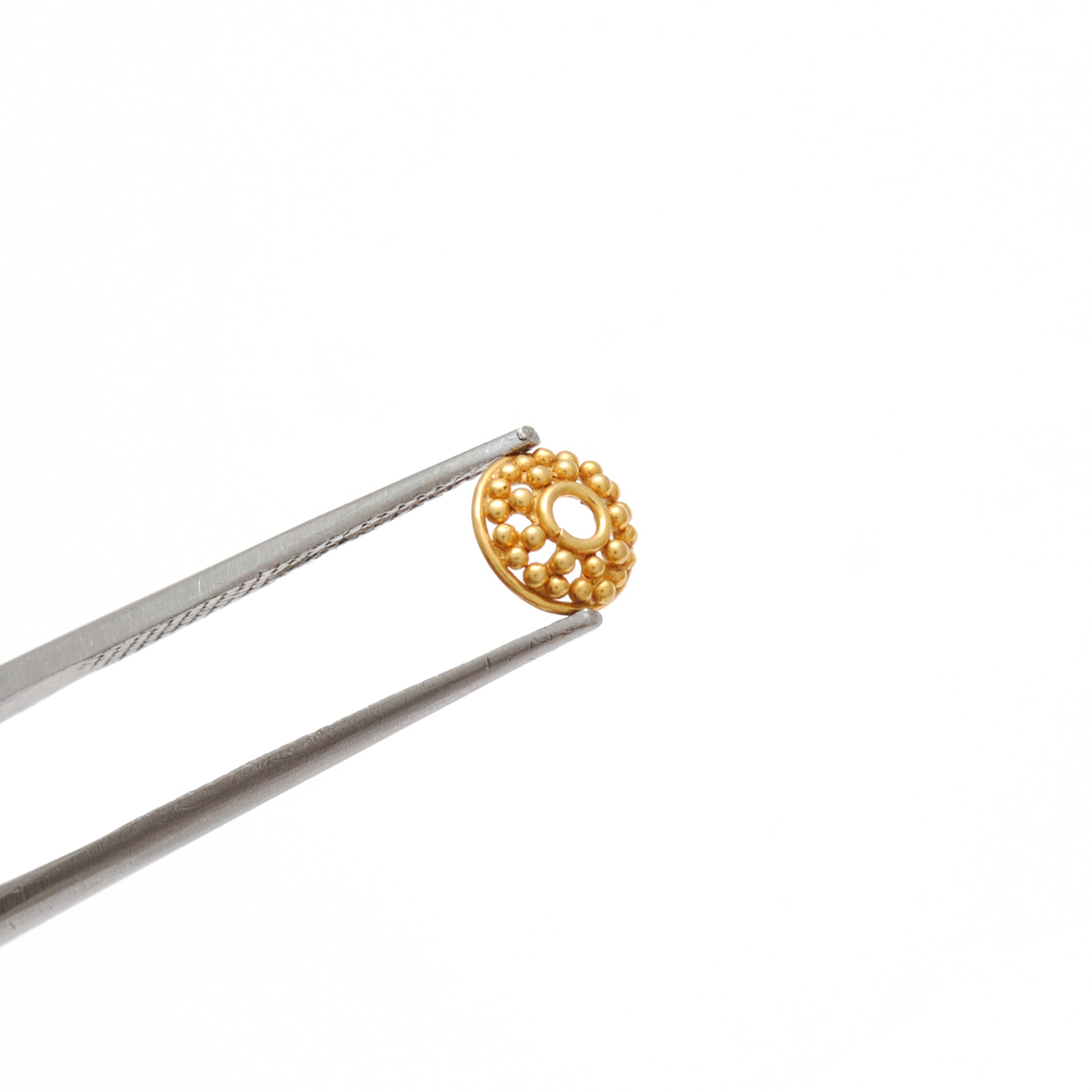 18K gold fancy round bead caps 6mm styled on jewelry