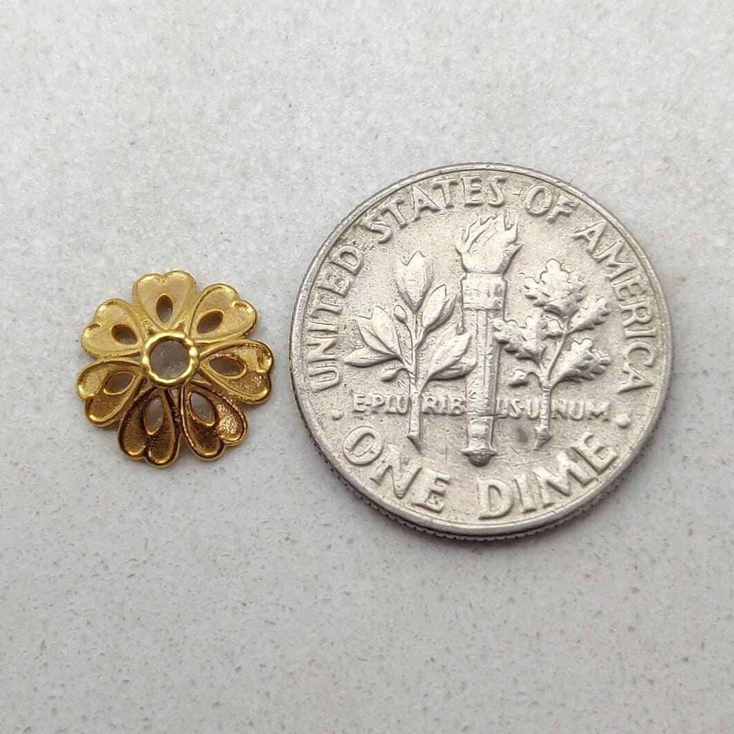 18K gold floral spacer cap 9mm styled on gemstone strand