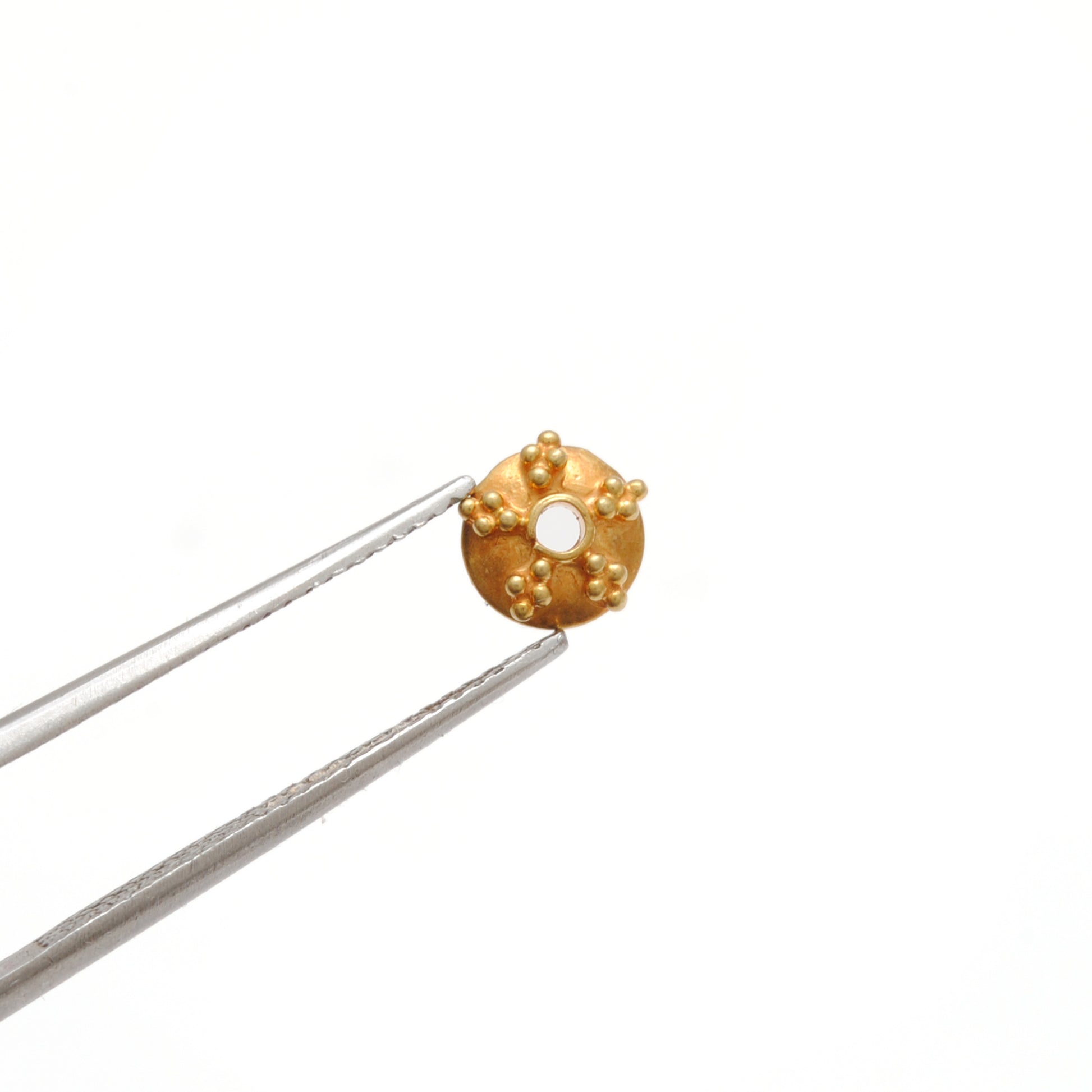 6mm 18K gold fancy cap styled on dainty jewelry