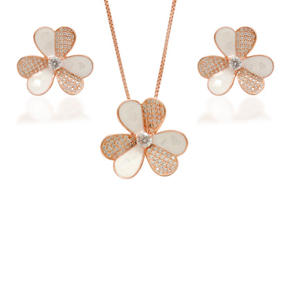 Flower-shaped jewelry set with rose gold and white elements on a white background
