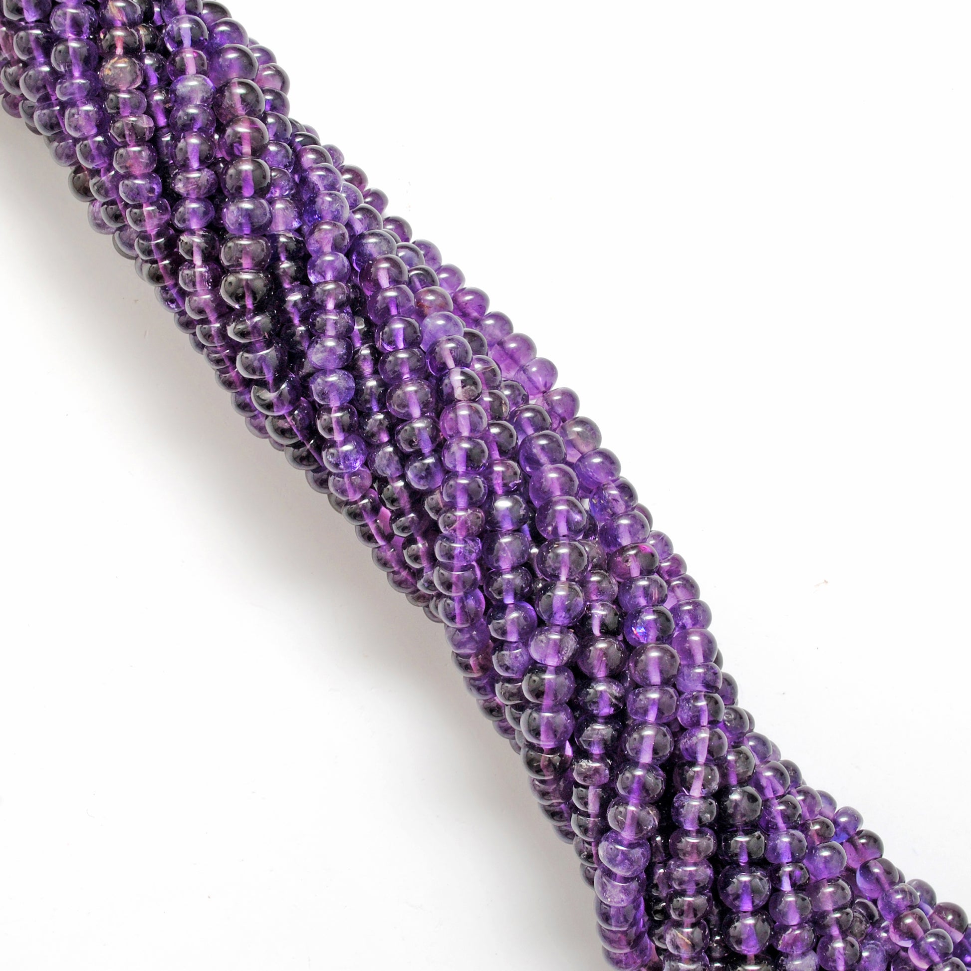 AAA amethyst rondelle beads - side profile lavender to deep purple