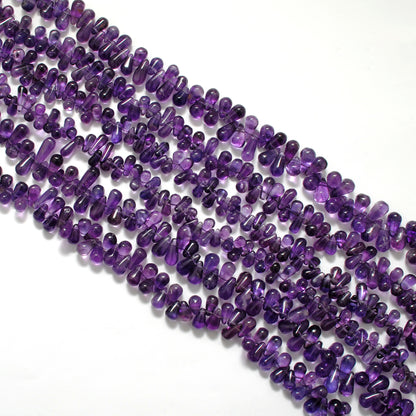 Amethyst drop beads AAA grade - close-up teardrop purple detail
