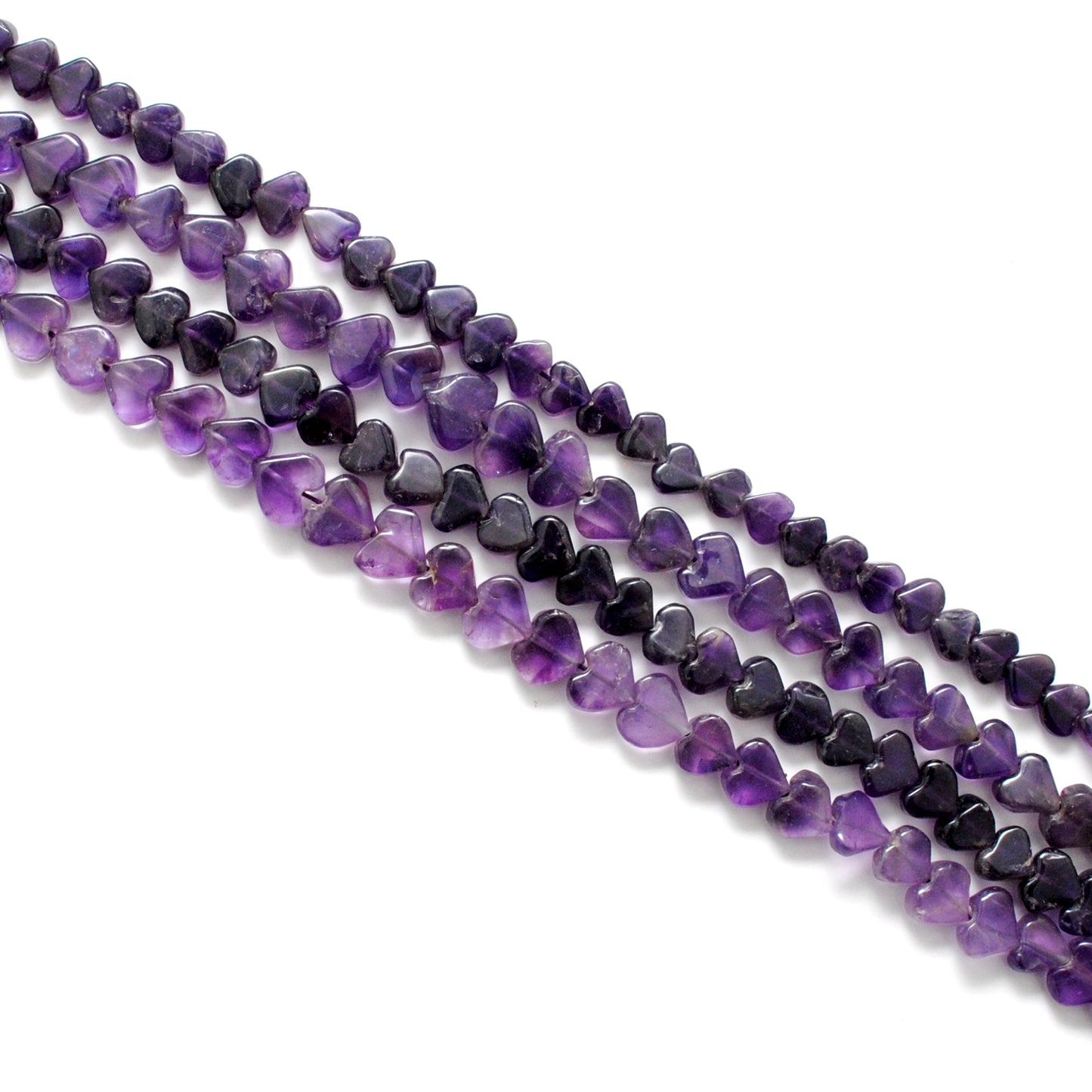 Amethyst heart shaped gemstone beads - close-up deep purple color