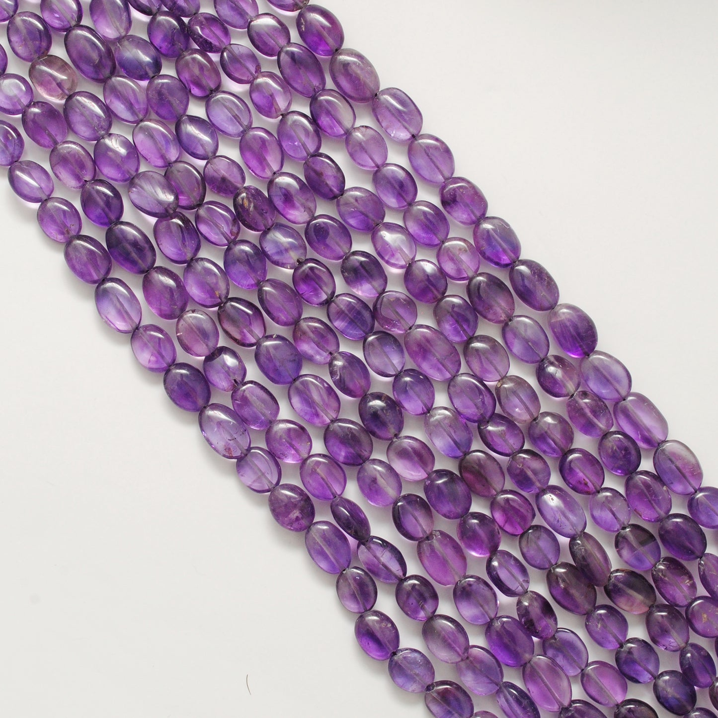 Amethyst elongated oval beads 9x13mm - close-up rich purple