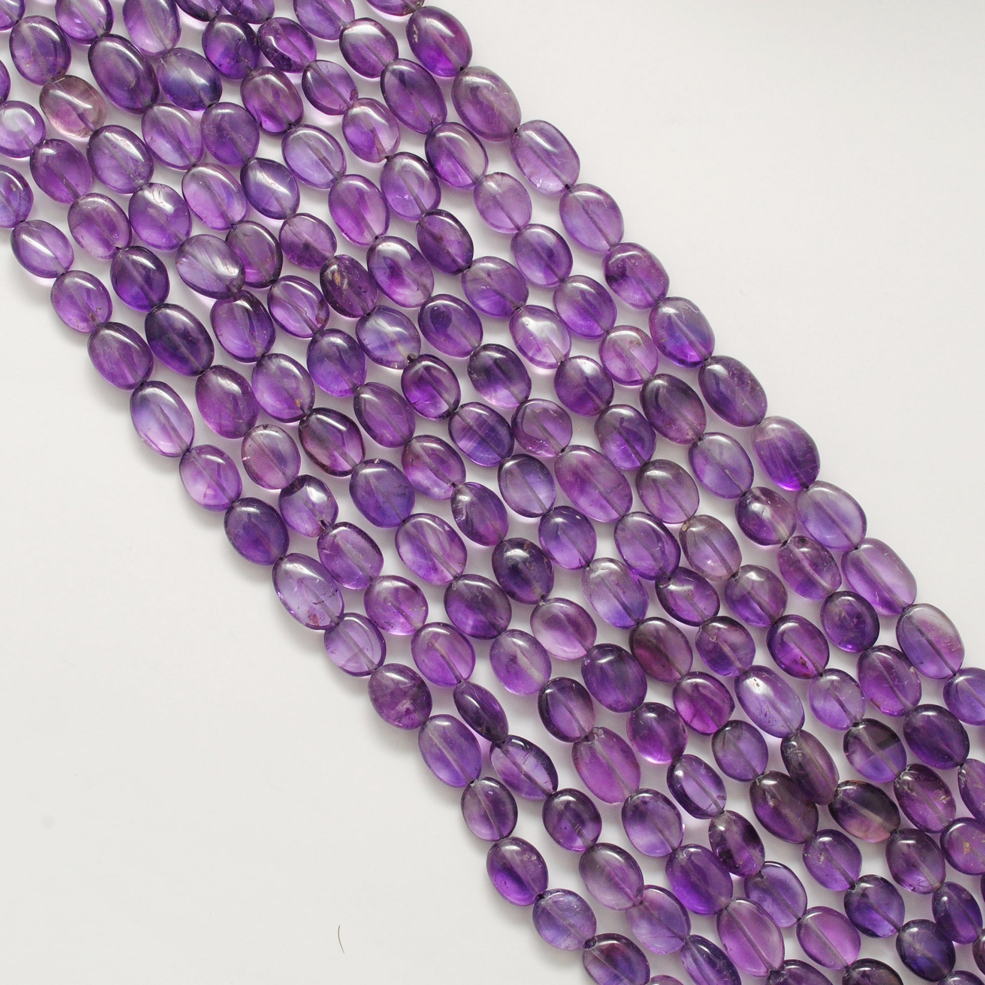 Amethyst elongated oval beads 9x13mm - close-up rich purple