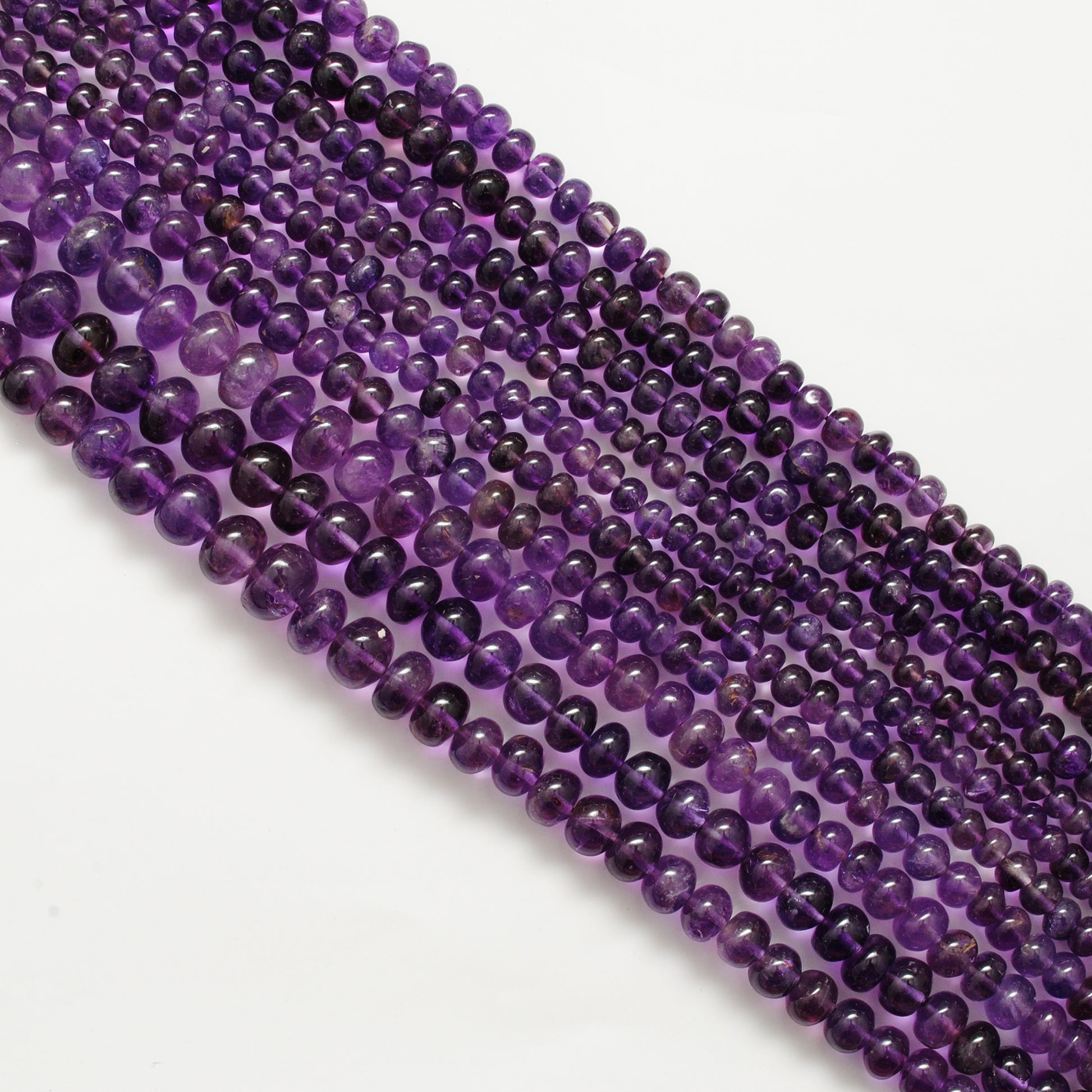 Amethyst rondelle beads 7mm - close-up smooth purple disc