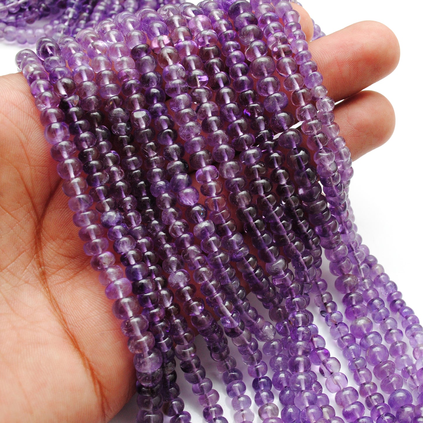 Amethyst rondelle beads wholesale strand - scale reference