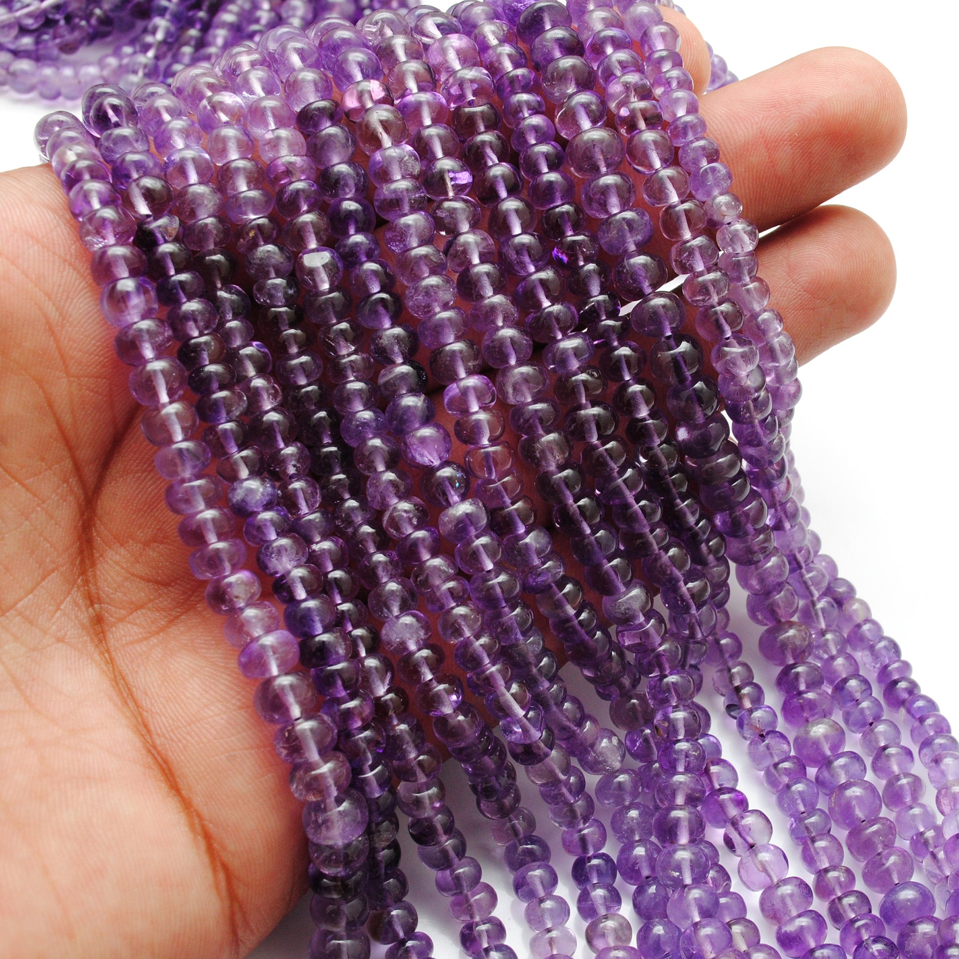 Amethyst rondelle beads wholesale strand - scale reference