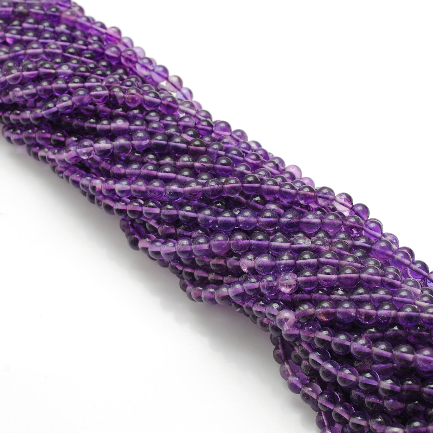 Amethyst round beads 4mm - close-up smooth purple color