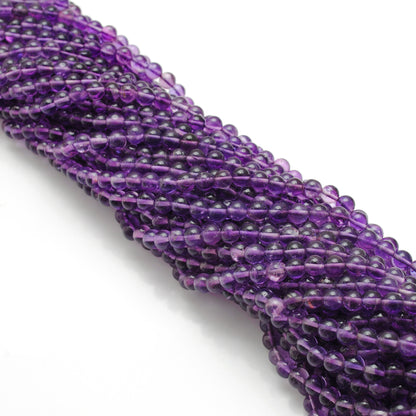 Amethyst round beads 4mm - close-up smooth purple color