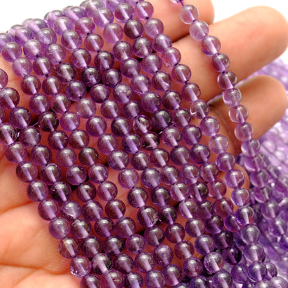 Amethyst 4-4.5mm smooth round beads - light refraction view