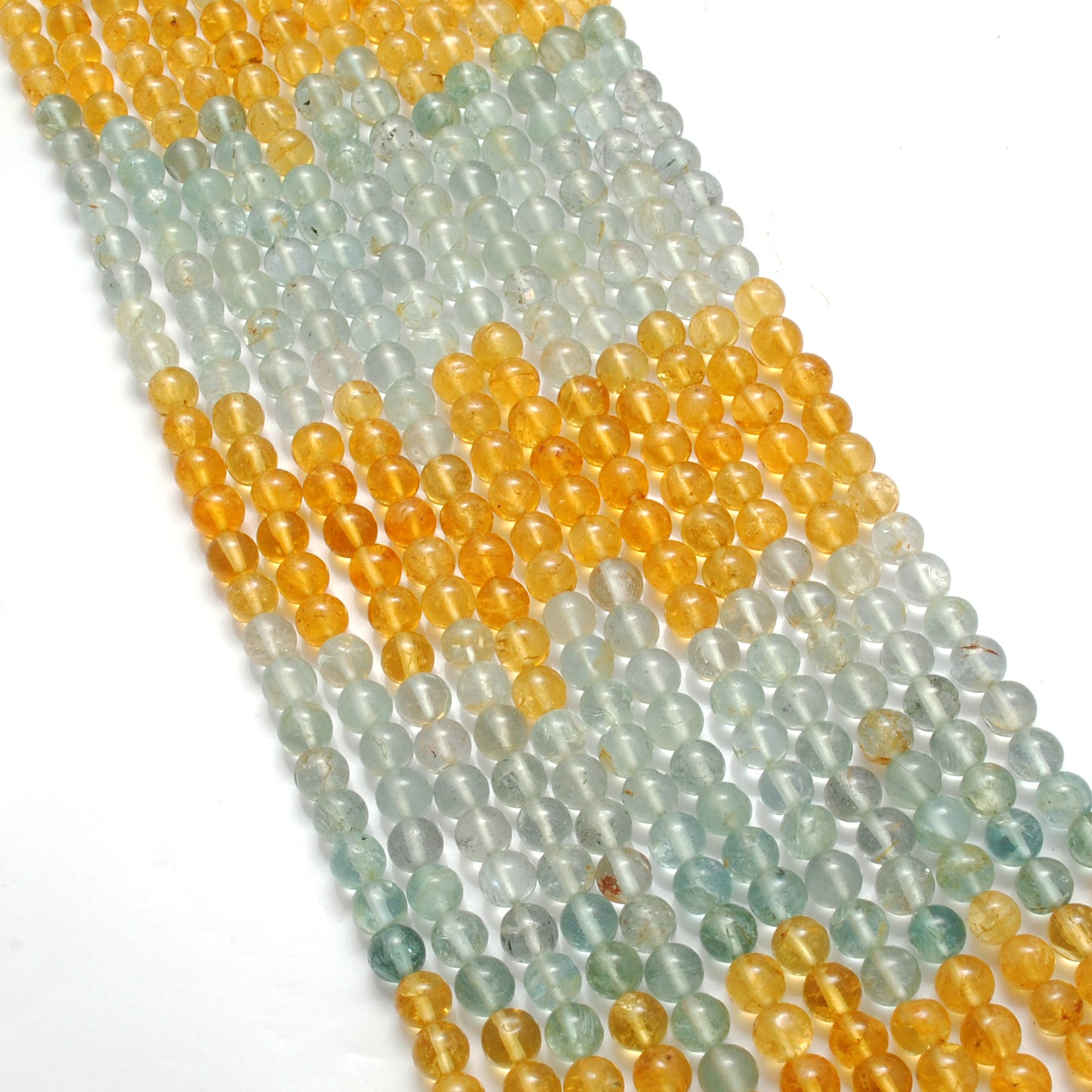 Aquamarine 5mm round beads close-up vivid ocean-blue colour