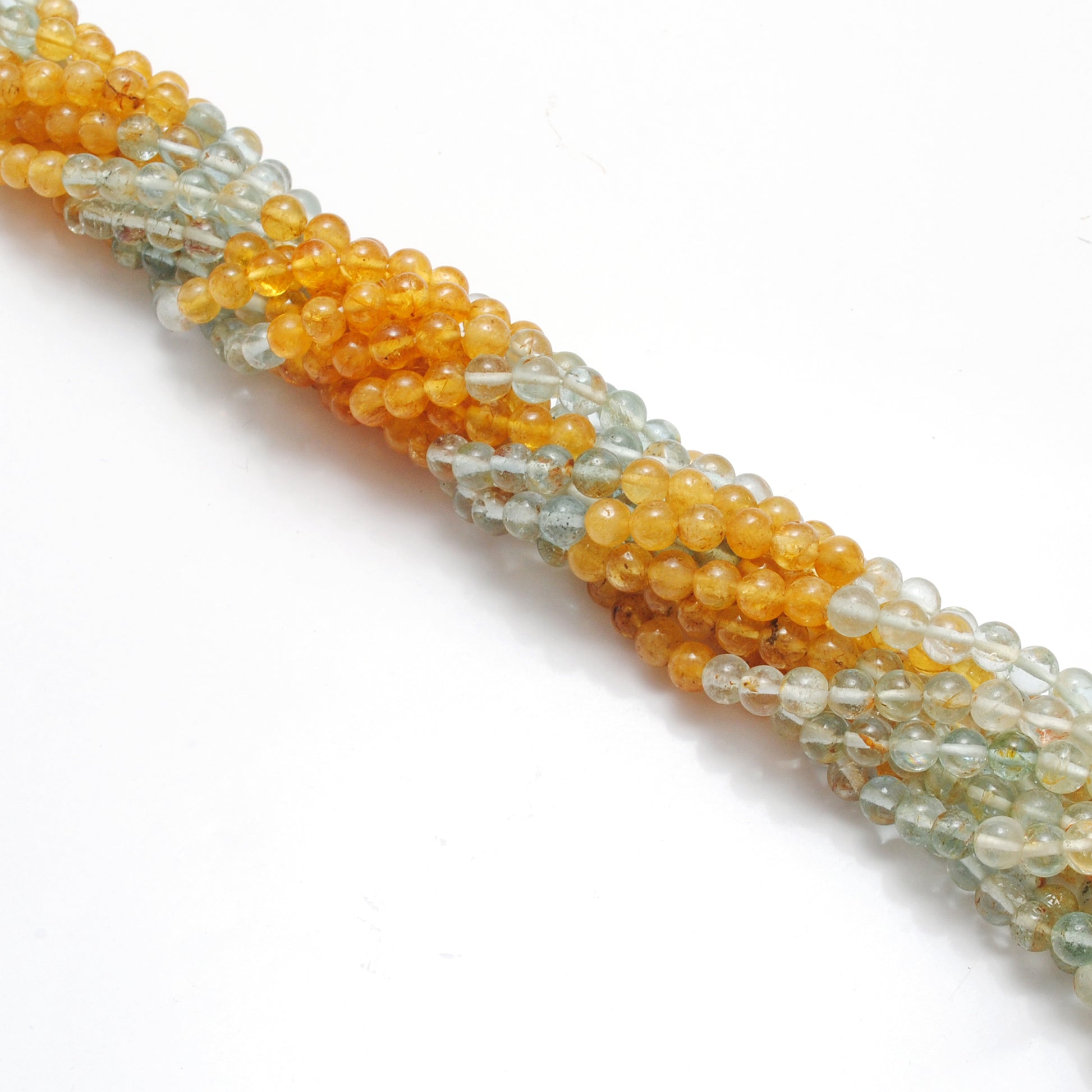 Aquamarine 5mm round beads detail shot - premium grade clarity