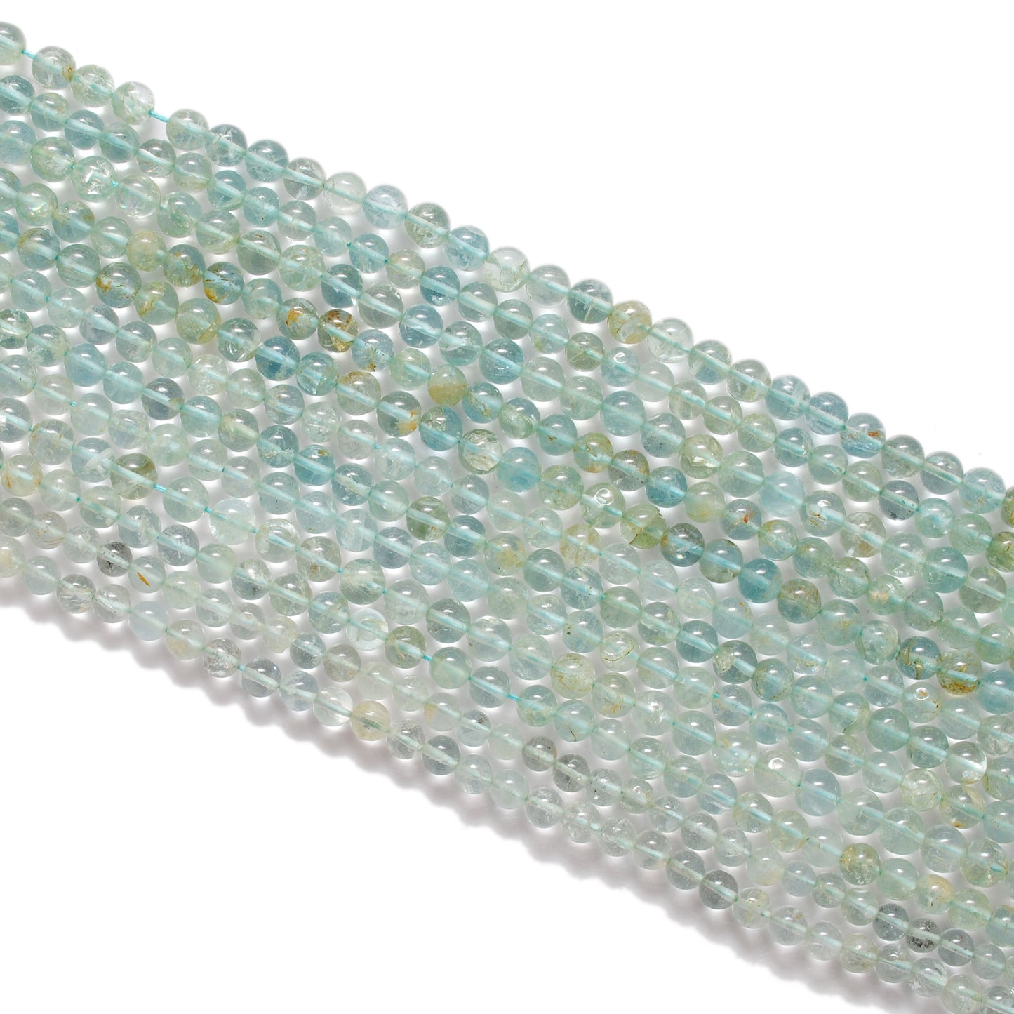 Aquamarine 6-6.5mm round beads close-up vivid ocean-blue colour