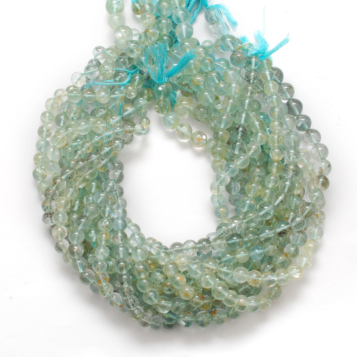 Aquamarine 7-9mm round beads - side profile deep blue color