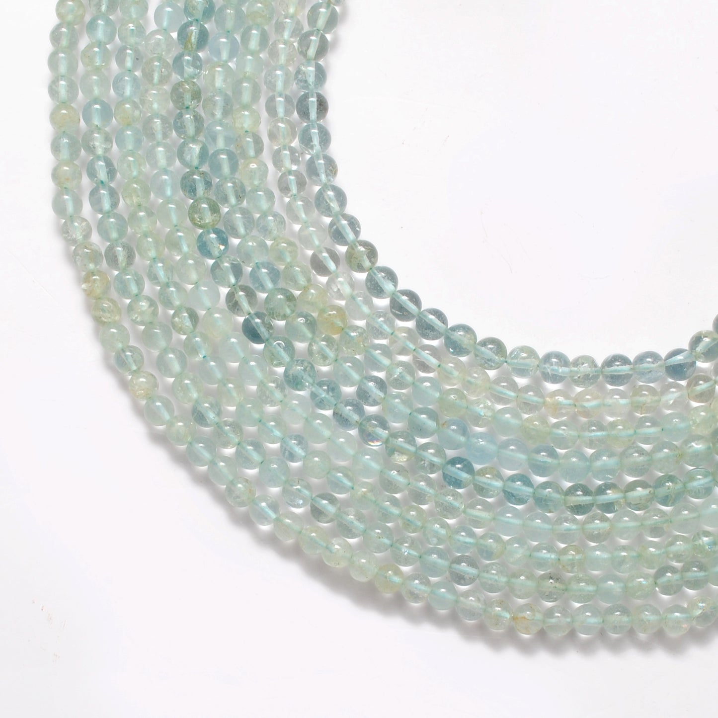 Aquamarine round beads close-up vivid ocean-blue colour 5-5.5mm