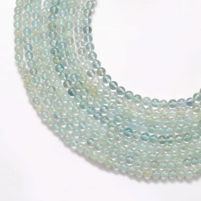 Aquamarine round beads close-up vivid ocean-blue colour 5-5.5mm