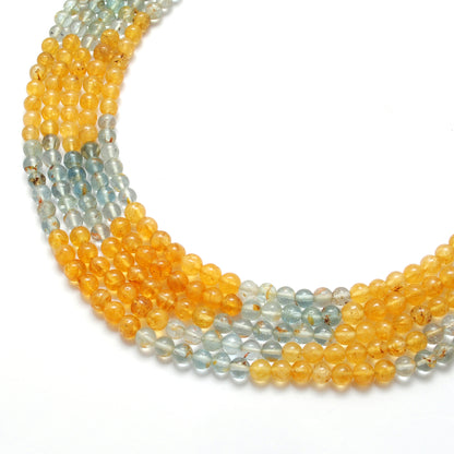 Aquamarine round beads scattered loose - blue-green range