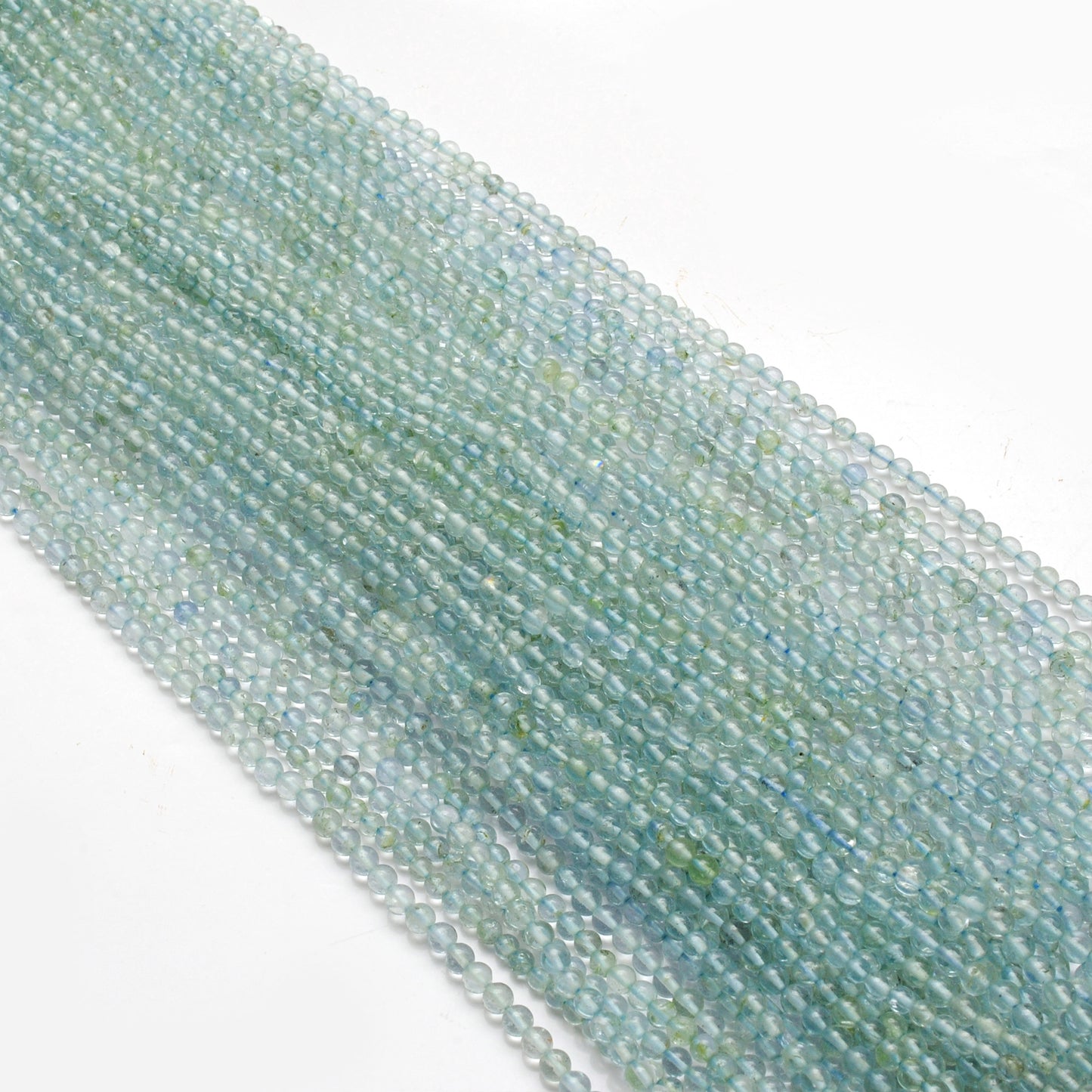 Aquamarine round gemstone beads - close-up sea green color detail