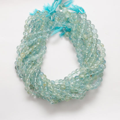 Aquamarine smooth round beads wholesale - scale reference Jaipur