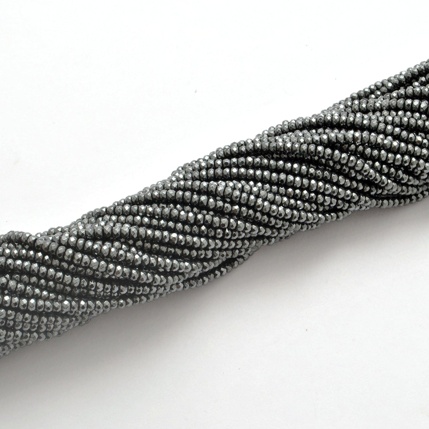 Black hematite faceted beads for jewelry making - scale reference