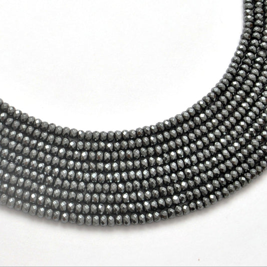 Black hematite faceted rondelle beads 15 inch strand - front view metallic