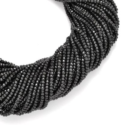 Black onyx faceted beads - side profile scattered loose beads
