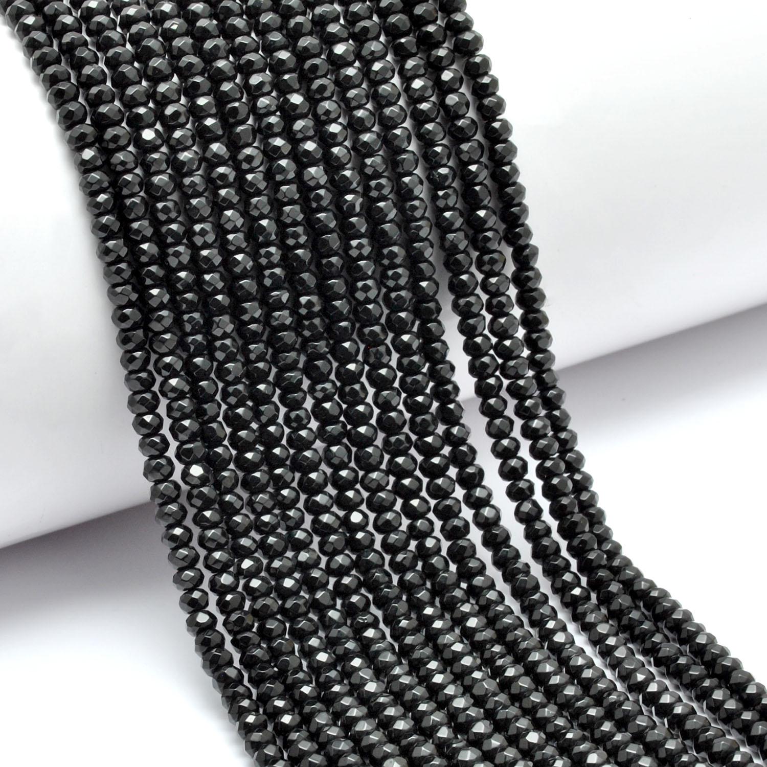 Black onyx faceted rondelle beads - close-up lustrous detail