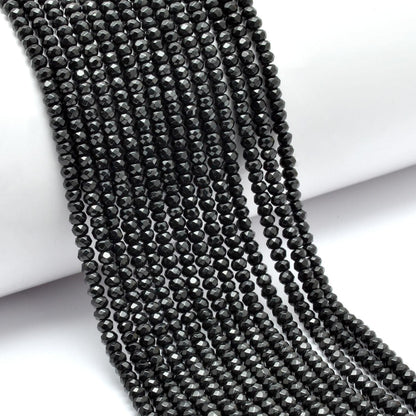 Black onyx faceted rondelle beads - close-up lustrous detail