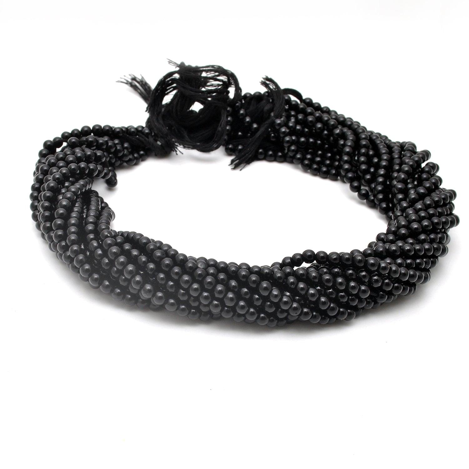 Black onyx plain round beads - close-up lustrous dark detail