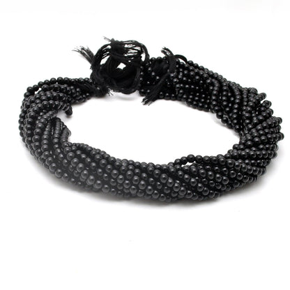 Black onyx plain round beads - close-up lustrous dark detail
