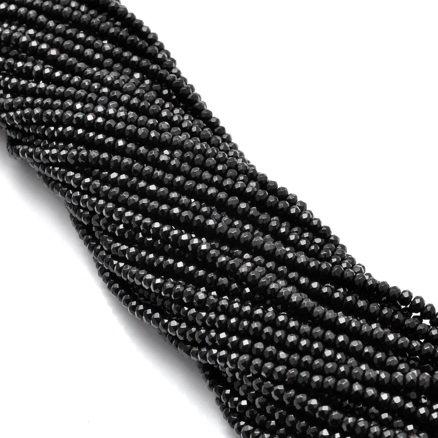 Black onyx rondelle beads for jewelry making - scale reference