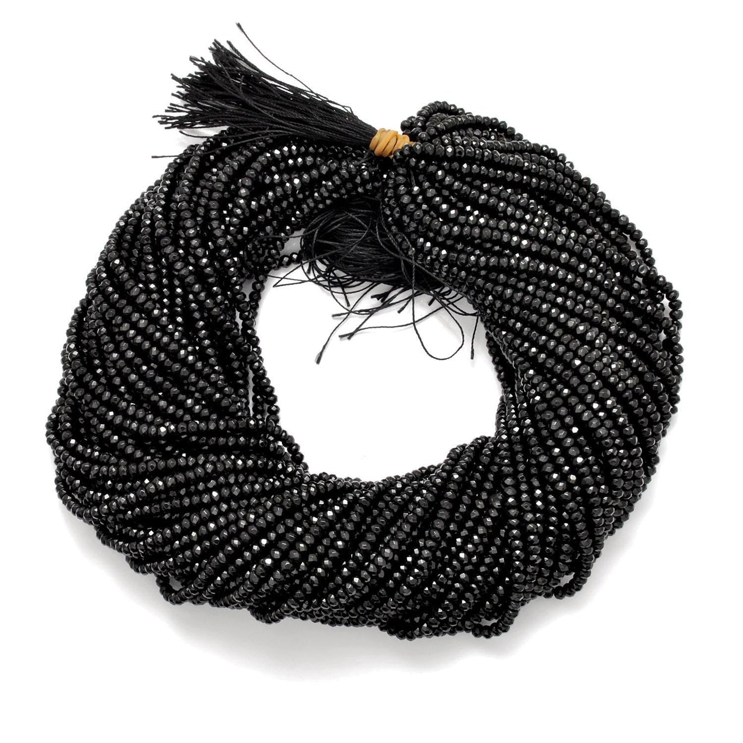 Black onyx rondelle beads strand - overhead flat lay dark view
