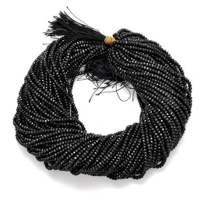Black onyx rondelle beads strand - overhead flat lay dark view
