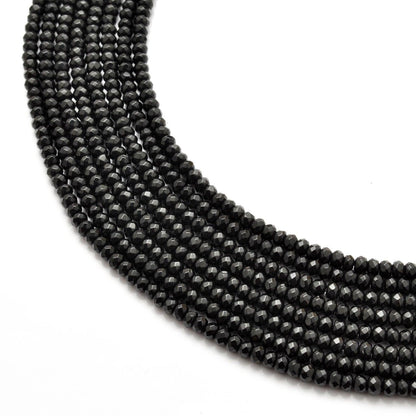 Black onyx rondelle faceted beads 14 inch strand - front view deep black