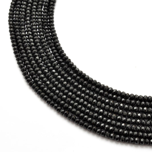 Black onyx rondelle faceted beads 14 inch strand - front view deep black