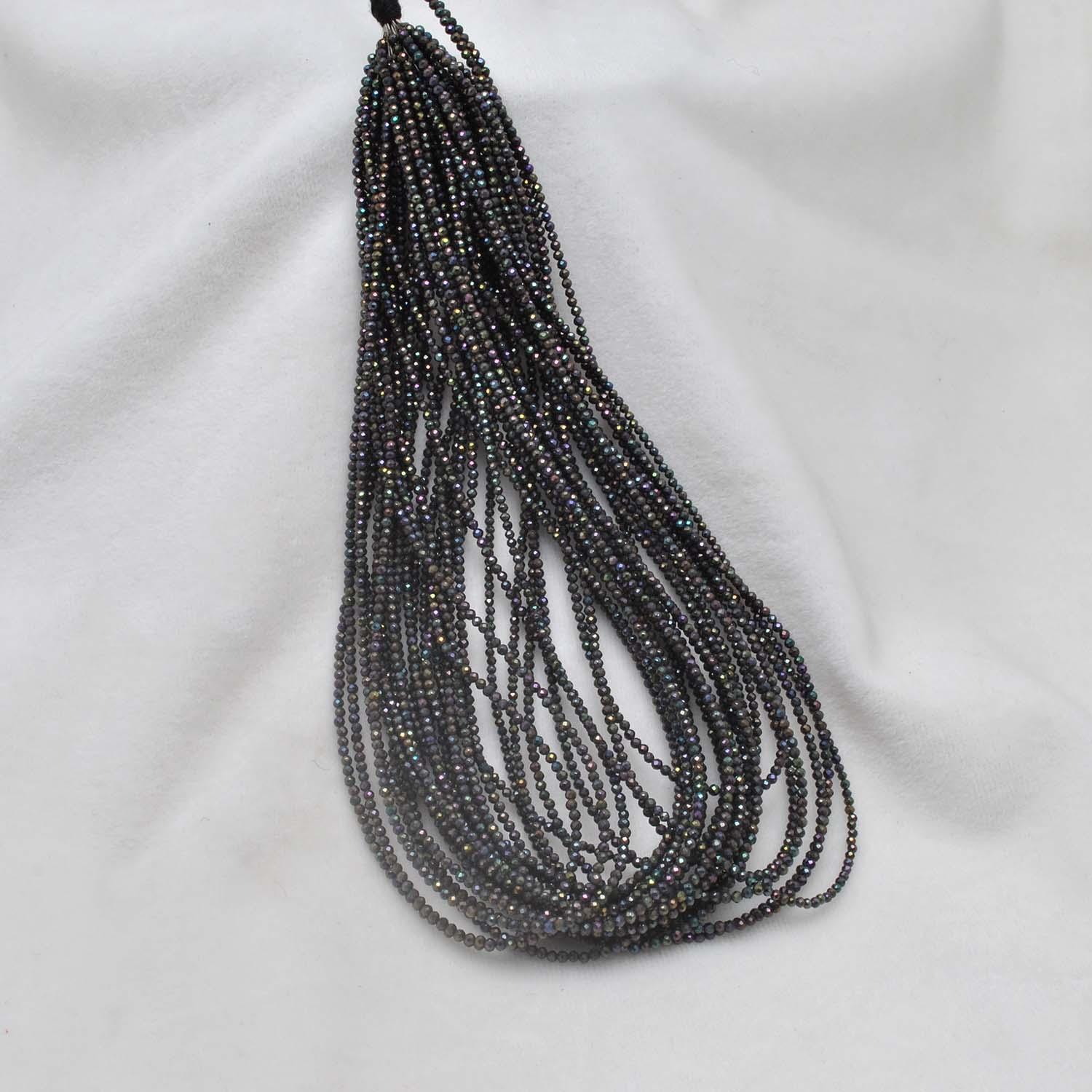 Black spinel coated beads - close-up brilliant faceted detail