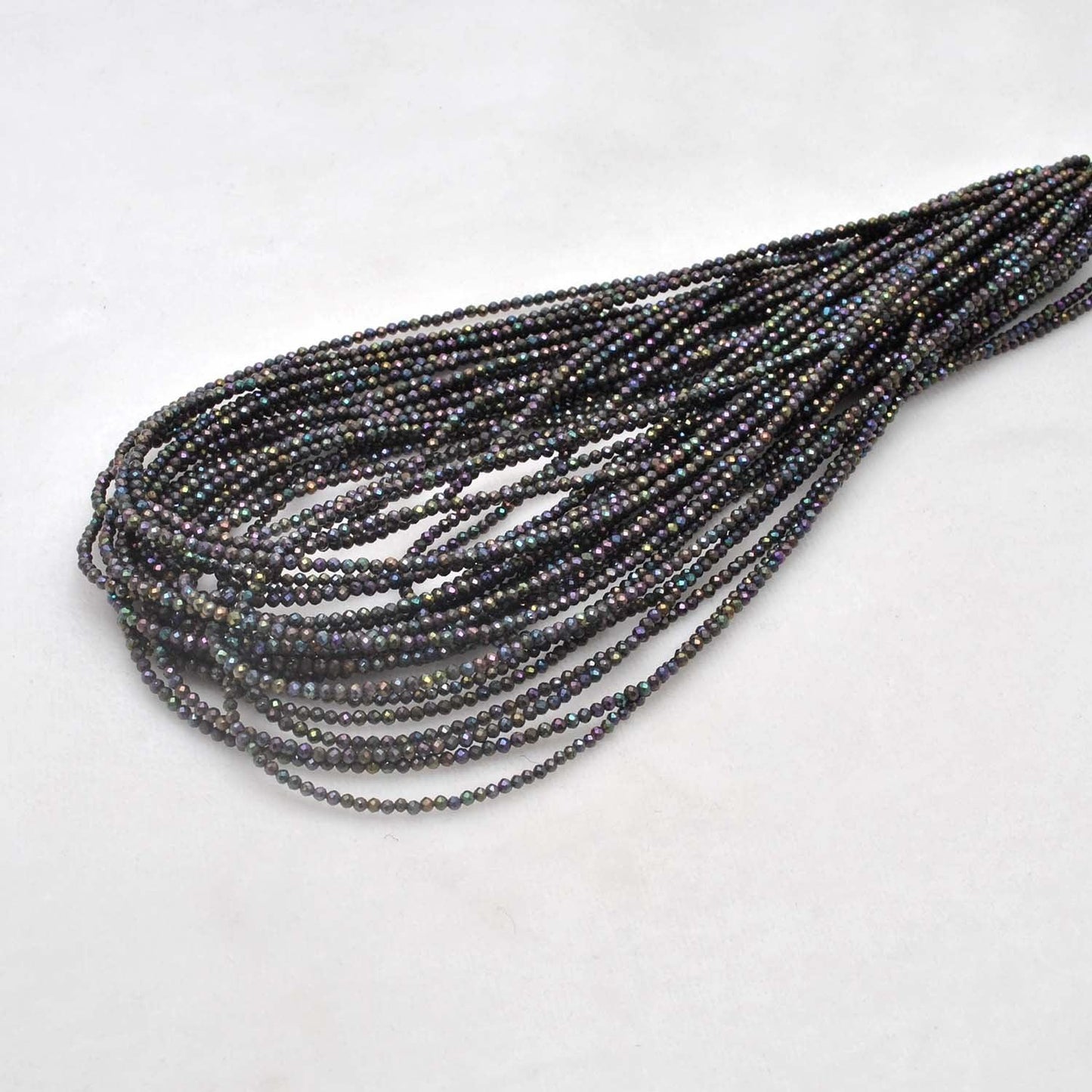 Black spinel coated round faceted beads 16 inch strand - front view jet black