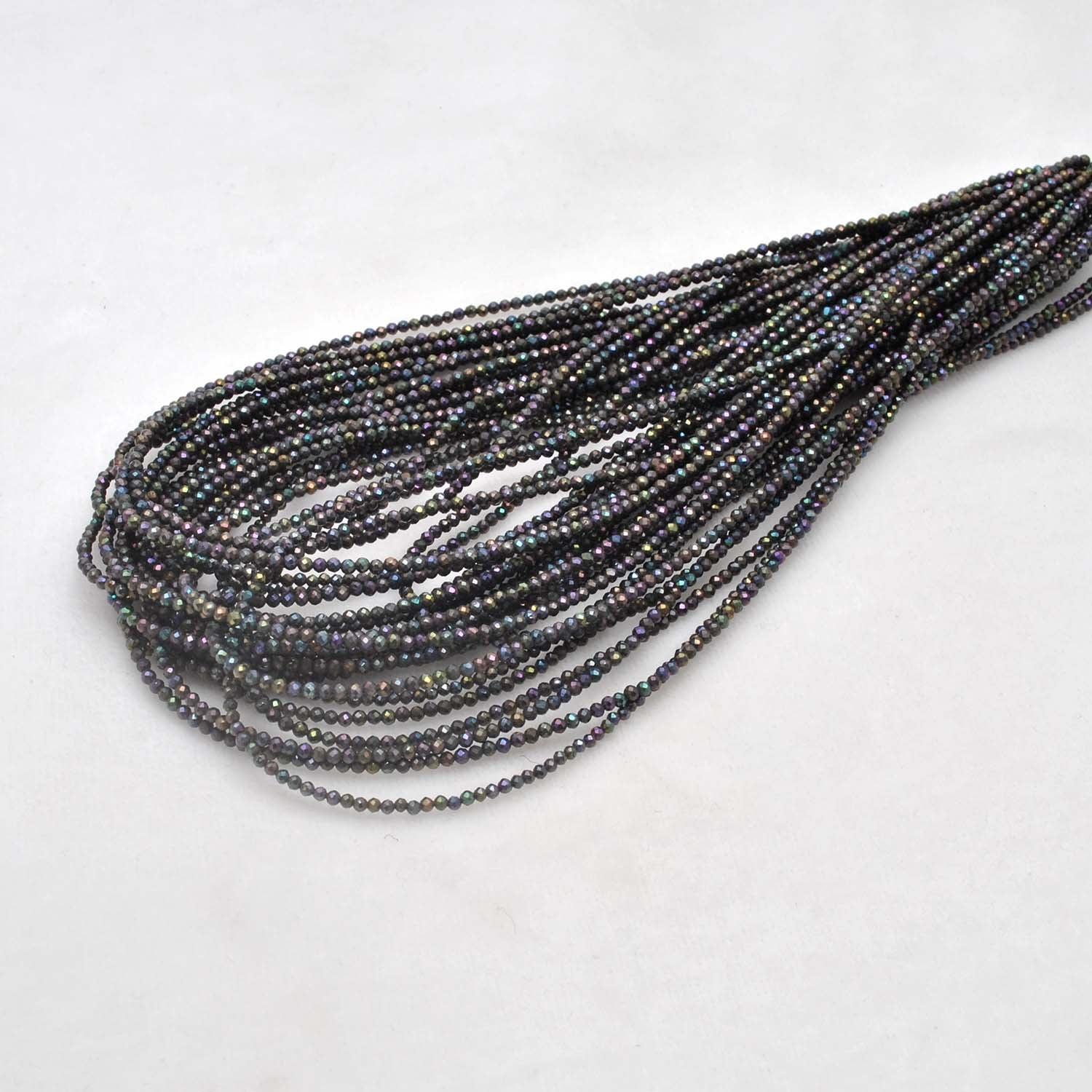 Black spinel coated round faceted beads 16 inch strand - front view jet black