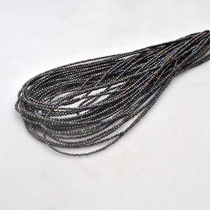 Black spinel coated round faceted beads 16 inch strand - front view jet black