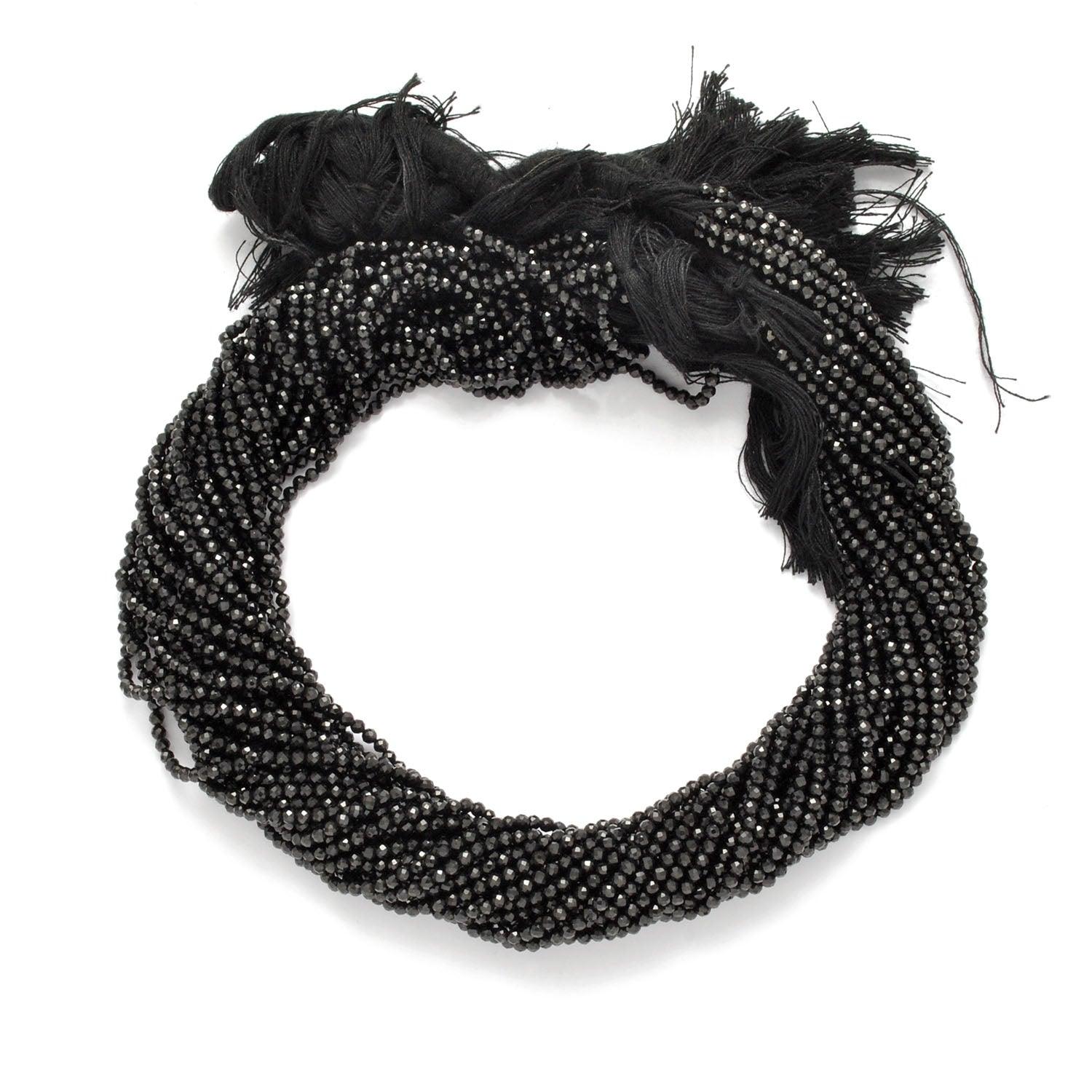 Black spinel round faceted beads - close-up brilliant lustre detail