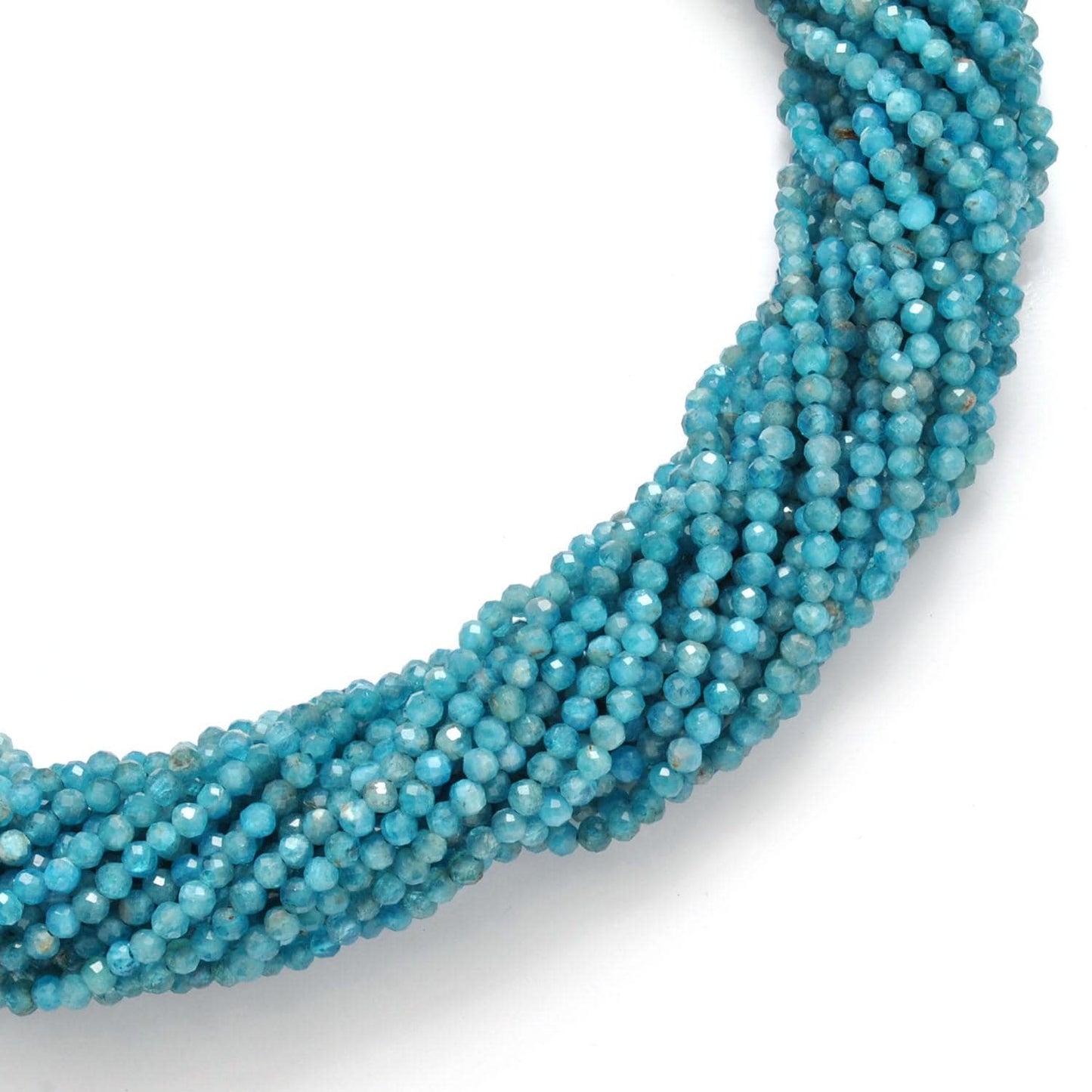 Blue apatite round beads v2 - close-up vivid teal-blue faceted